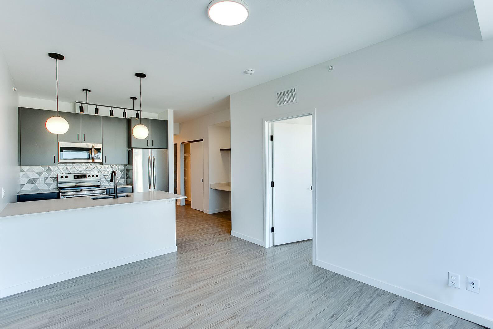 a midline apartments living room and kitchen areas