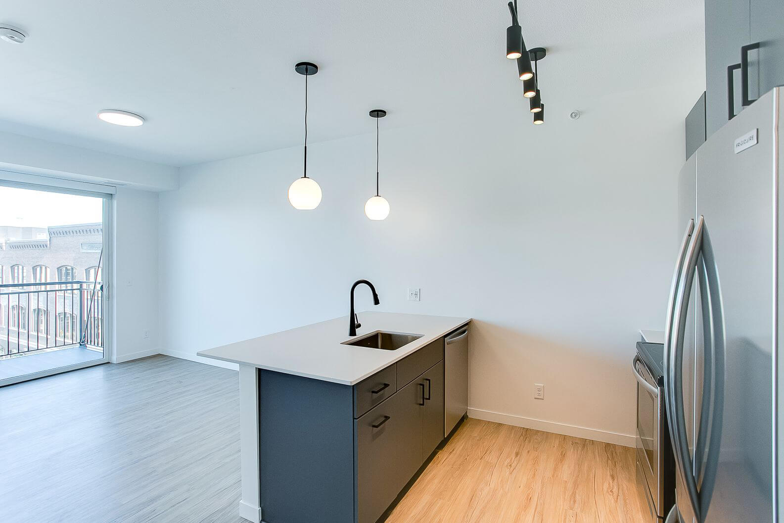 a midline apartments kitchen and living room areas